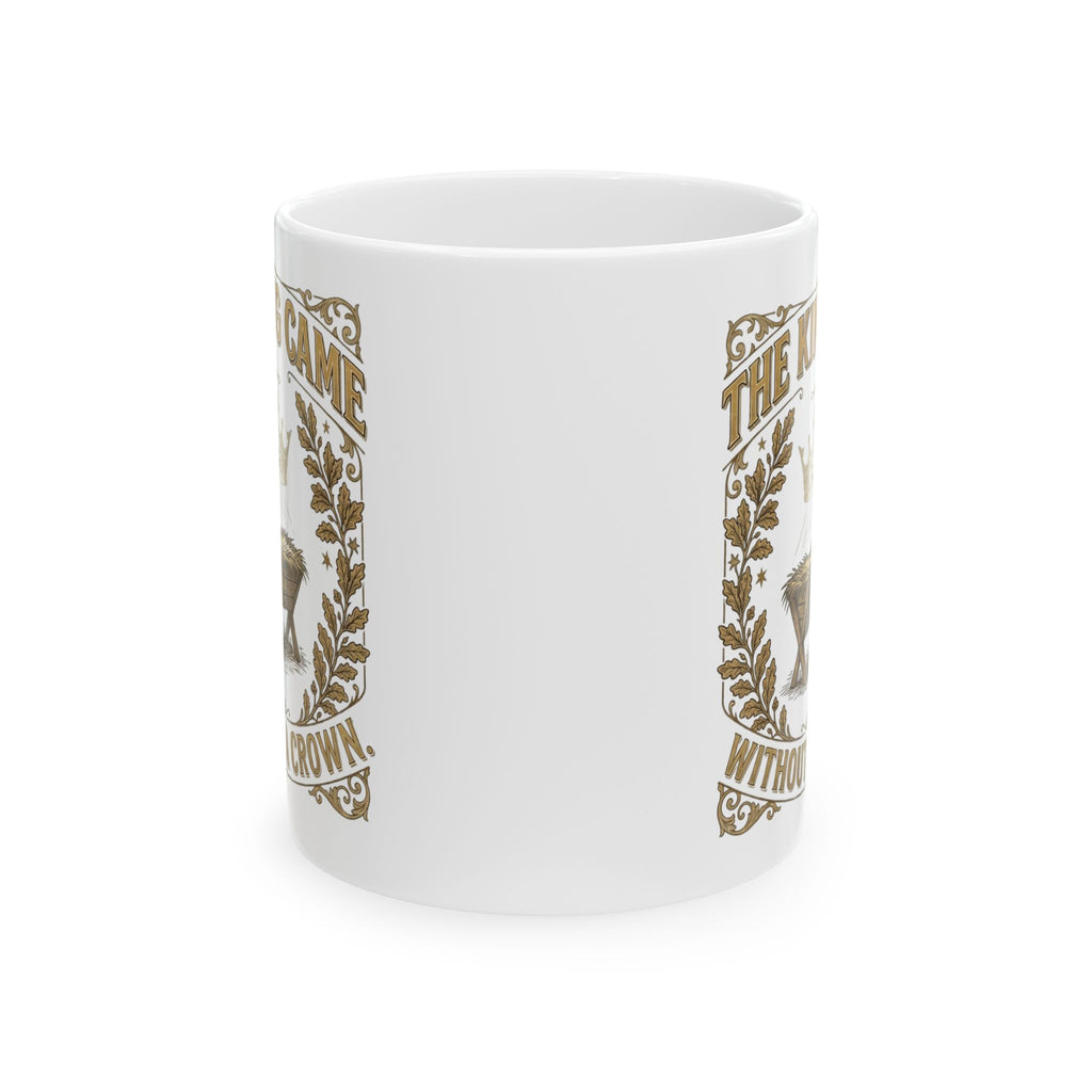 The King Came Without a Crown white Christmas mug with vintage gold frame, crown of light and nativity manger
