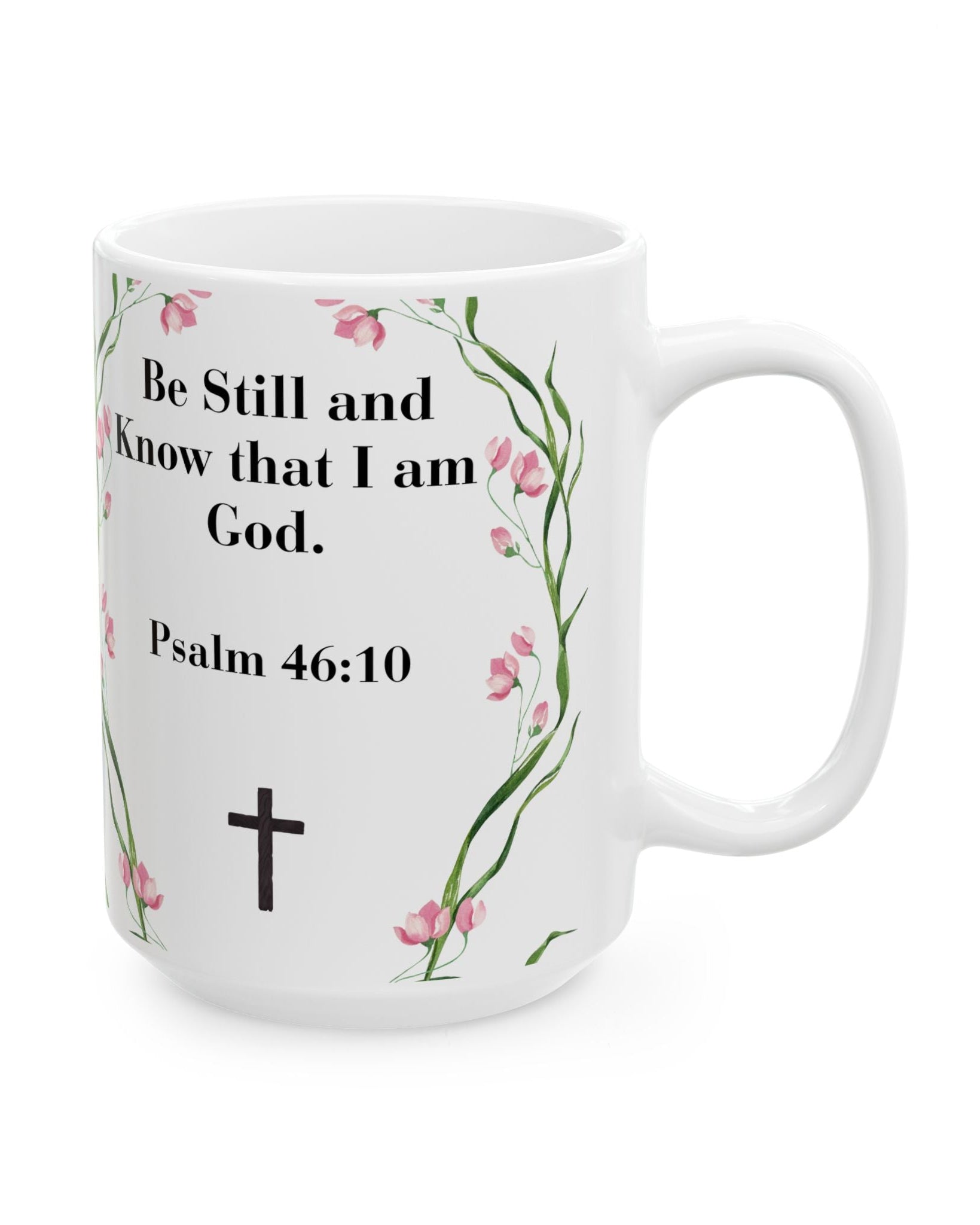White mug with floral design, cross, and Bible verse text on a white background