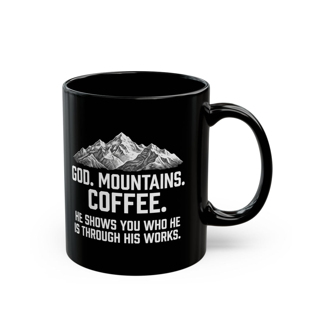 Black ceramic mug with God. Mountains. Coffee. mountain design and the text "He Shows You Who He Is Through His Works," available in 11oz and 15oz sizes, shown on a white background.