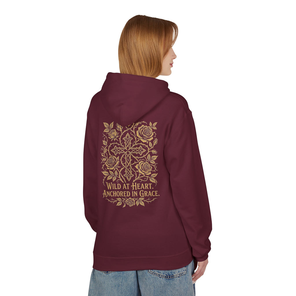 Wild at Heart Anchored in Grace faith floral hoodie in maroon with gold celtic cross and rose back print, worn by woman
