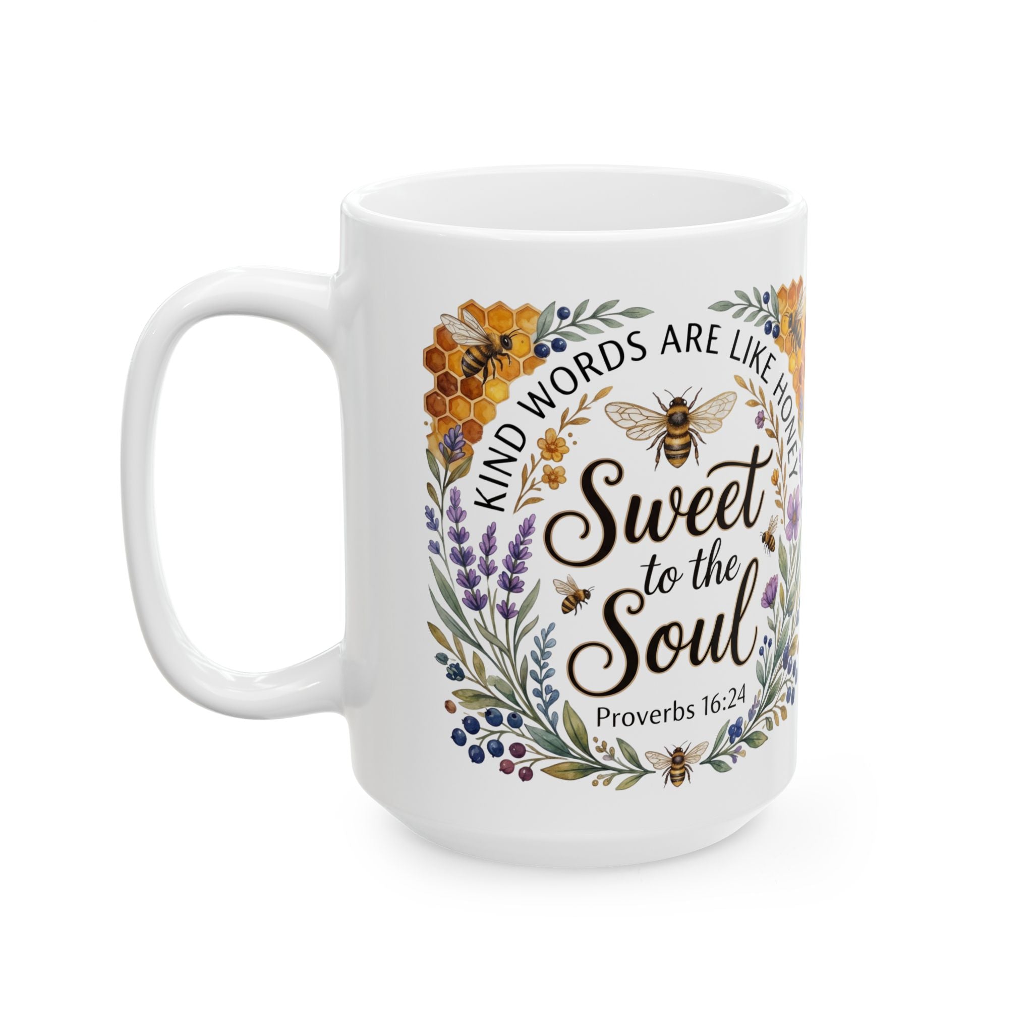 White 15oz ceramic coffee mug with Kind Words Are Like Honey Sweet to the Soul Proverbs 16:24 design featuring a botanical wreath with honeybees honeycomb lavender and wildflowers on a white background