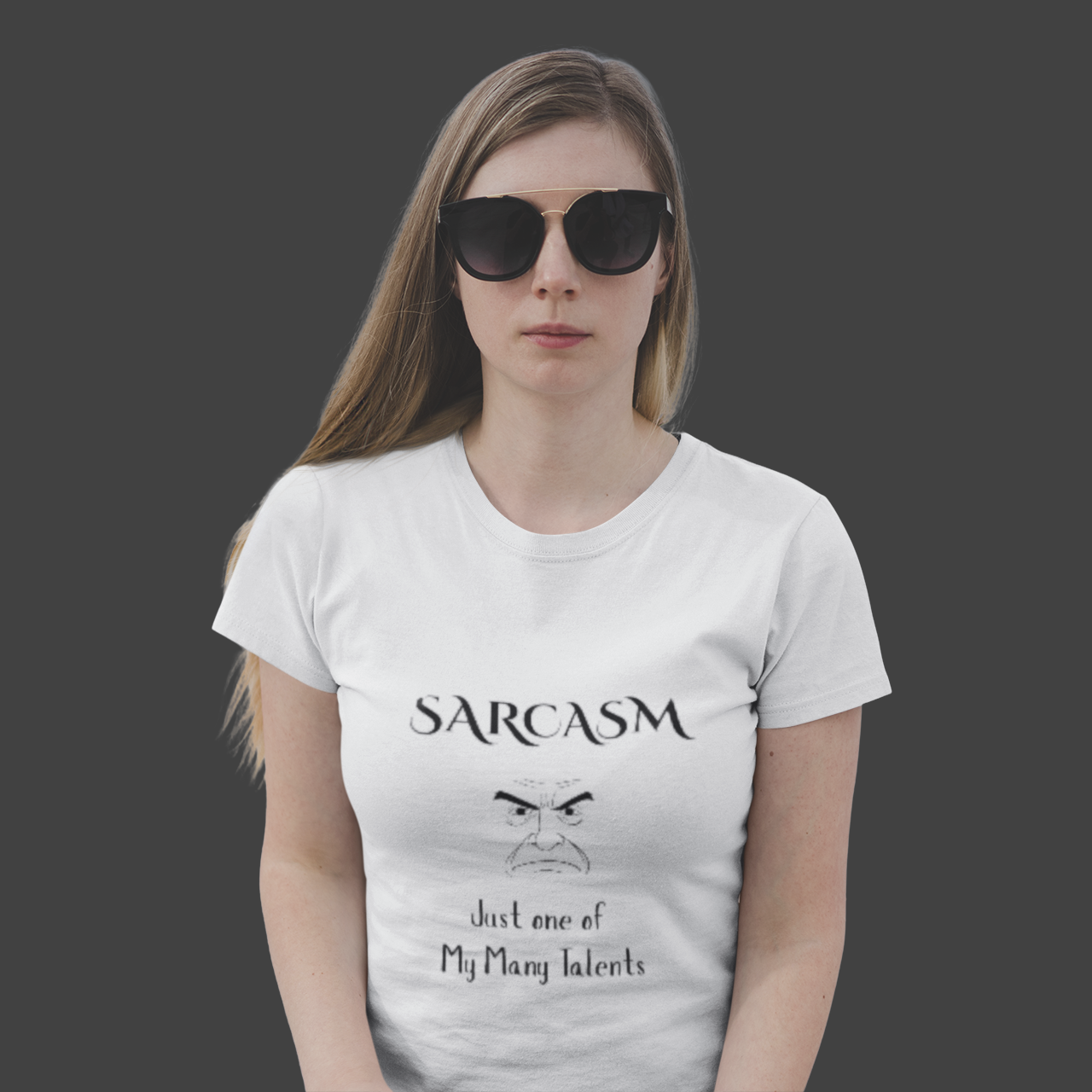 Person wearing a white t-shirt with 'SARCASM just one of my many talents' text and graphic.